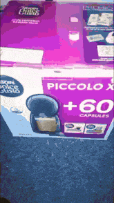 a box of piccolo x 60 capsules sits on a carpet