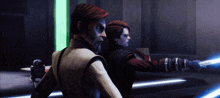 a man and a woman are holding lightsabers in front of a green light