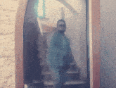 a blurry photo of a man walking down stairs