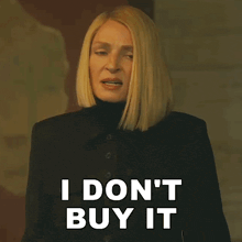 a woman says " i don 't buy it " while wearing a black coat