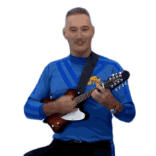 playing guitar anthony wiggle the wiggles guitarist strumming