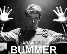 a black and white photo of a man with absolute bummer written on the bottom
