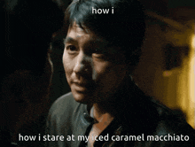 a close up of a man with the words how i stare at my iced caramel macchiato below him