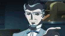 a man with glasses and a bow tie is making a gesture