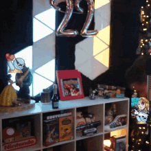 a shelf with a bottle of wine and a box that says corvcomm on it
