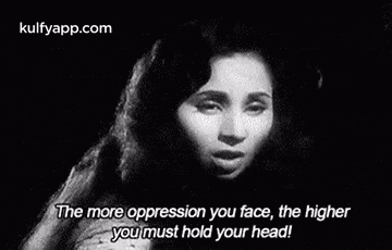 a black and white photo of a woman singing in a movie .