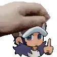 a hand is holding a cartoon character 's head and pointing .