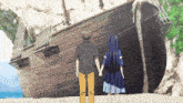 a man and a girl are holding hands in front of a shipwreck