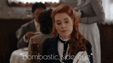 a woman sitting at a table with the words bombastic side eye written above her