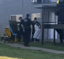 a man in a dallas police uniform stands next to a yellow stretcher