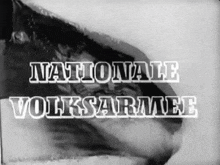 a black and white photo of a flag with the words nationale volksarmee on it