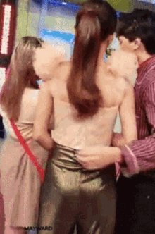a group of people standing next to each other with the word mashward on the bottom right corner