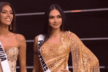 two women are standing next to each other with one wearing a sash that says philippines