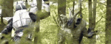 a man in a robot costume is standing in the woods .
