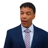 a man in a suit and tie making a surprised face