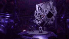 a purple room with a statue of a robot with the letter a on the front