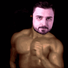 a shirtless man with a beard looks at the camera with his hand on his chest