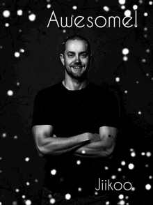 a black and white photo of a man with his arms crossed and the caption awesome jiikoo