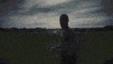 a blurred image of a person 's torso with a white heart shaped object in the middle