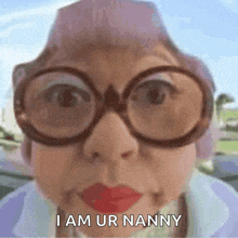 an elderly woman wearing glasses and red lipstick says i am ur nanny .