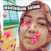 a woman wearing a hijab with hearts around her face and the words waalaikum salam above her