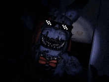 bonnie from five nights at freddy 's is wearing a pair of sunglasses with a checkered pattern on them .