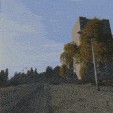 a blurred image of a street with a tall building in the background