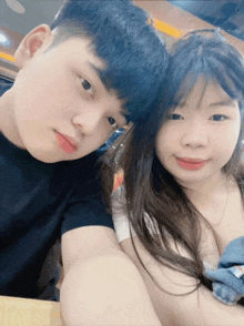 a man and a woman pose for a picture together