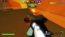 a person is holding a shotgun in a video game with a win button
