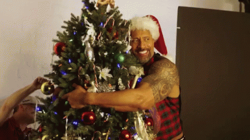 Hugging Christmas Tree GIF - Hugging Christmas Tree Award GIFs