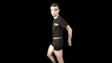 a man wearing glasses and a shirt that says ' escape ' on it