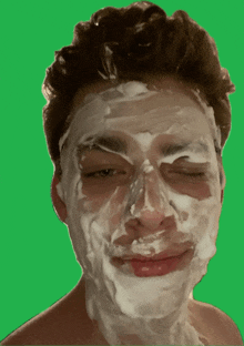 a man with shaving cream on his face is making a funny face
