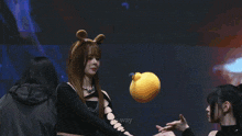a woman playing with a stuffed animal in front of a blue background that says no way