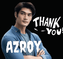 a man with his arms crossed next to a sign that says thank you