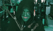 a person with green paint on their face and the words lack of social skills