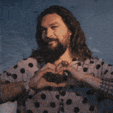a man in a polka dot shirt holds a doge coin in front of his chest
