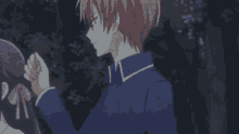 a man is holding a woman 's hand in a dark forest .