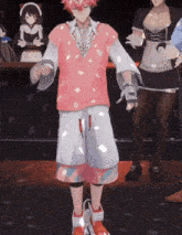 a man in a pink vest and white shorts stands in front of a maid