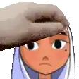 a person is petting a cartoon character 's head with a towel on it .