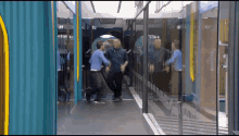 two men are standing in a hallway with a reflection of themselves in the mirror