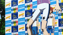 a person standing in front of a wall that says subuta