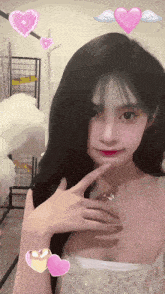 a girl in a white dress has pink hearts on her head