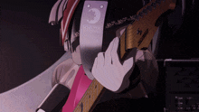 a person is playing a guitar with a sticker that says schechter on it