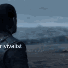 a man standing in front of a body of water with the word rivivalist written on his back .