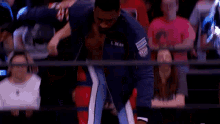 a man in a wrestling ring with the name s. dean on his shirt