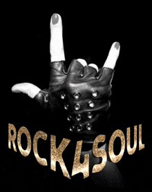 a black and white photo of a hand making a horns sign with the words rock & soul below it