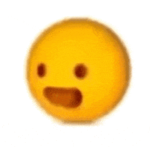 a close up of a yellow smiley face with a surprised look on its face .