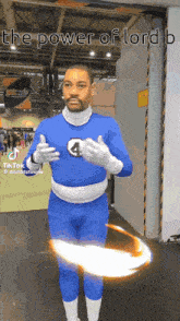 a man in a blue superhero costume with the power of lord b written on the bottom