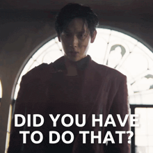 a man standing in front of a window with the words " did you have to do that " below him