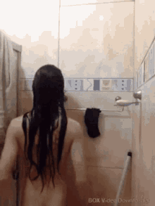 a naked woman is taking a shower in a bathroom with the words box video downloader on the bottom